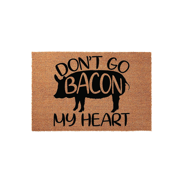 Funny Pig Doormat featuring a black silhouette of a pig with the punny text Don't Go Bacon My Heart printed in bold black lettering on a natural tan coir fiber background, creating a whimsical welcome mat for any farmhouse