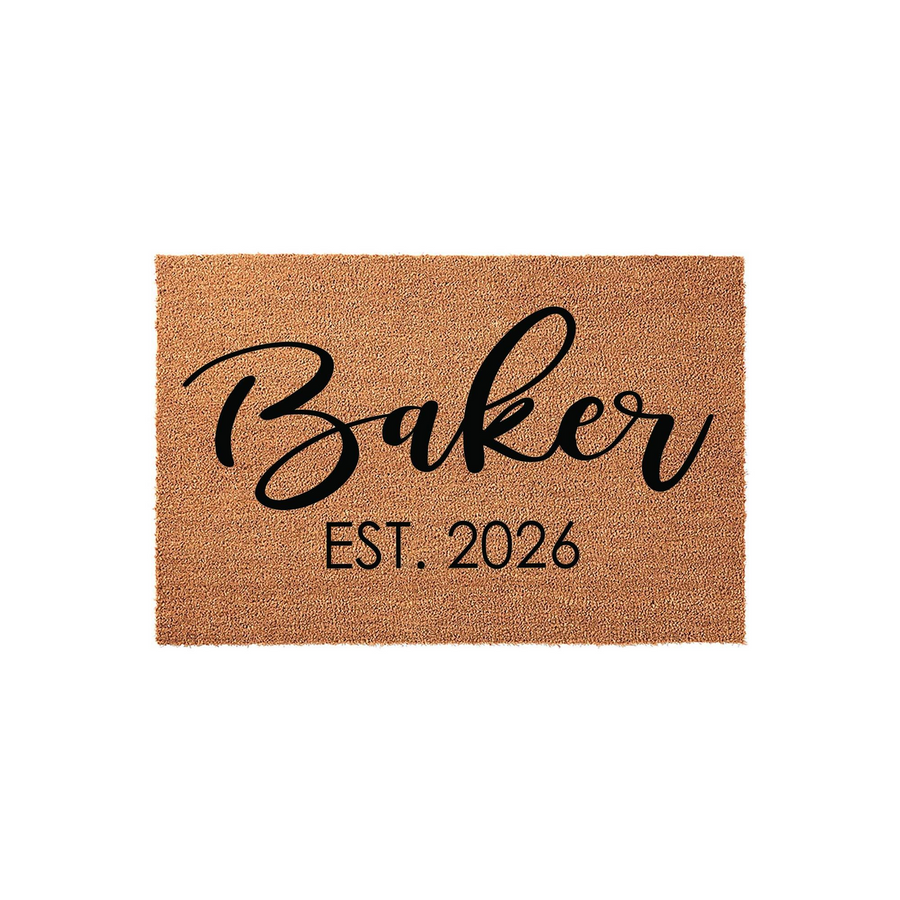 Personalized family name coir doormat featuring a natural tan fiber texture with black script lettering that displays a custom last name and an established year, creating a welcoming entrance for a new home or housewarming