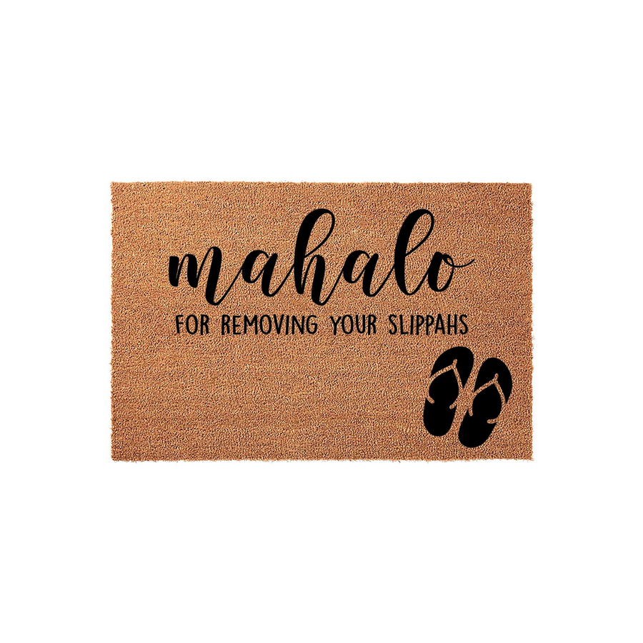Mahalo for removing your slippahs doormat featuring a natural coir texture with black text and a pair of flip-flop icons, creating a fun Hawaiian-themed entryway decor piece for your home or porch that welcomes guests with island