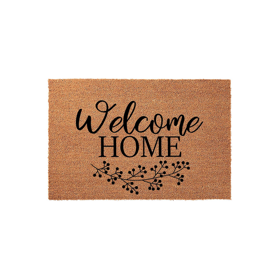 Welcome Home coir doormat featuring a natural tan fiber texture with black printed text and a delicate berry branch illustration, presented on a clean white background for a classic farmhouse entryway decor style.