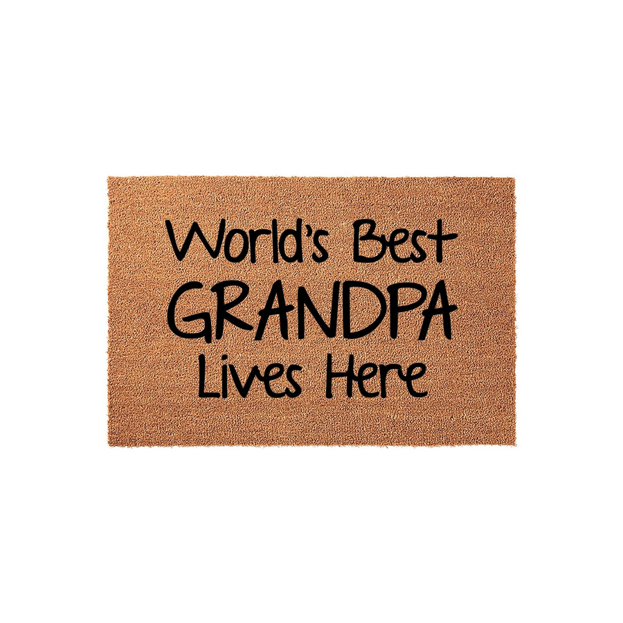World's Best Grandpa Lives Here coir doormat featuring bold black text printed on a natural brown fiber surface, presented against a clean white background to highlight the celebratory message for a beloved family member.
