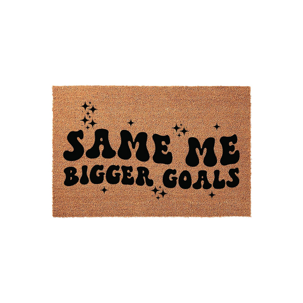 Same Me Bigger Goals doormat featuring a natural coir texture with bold, retro-style black lettering and decorative star accents, creating a motivational and stylish entryway decor piece for your home or apartment front door.