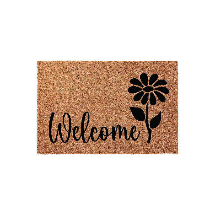 Floral Welcome Coir Doormat featuring a natural tan fiber texture with a bold black script font and a simple daisy flower illustration, creating a charming and rustic entryway accent for your home porch or front door decor.