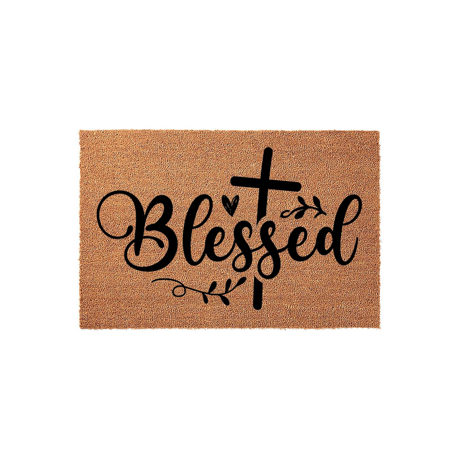 Blessed religious coir doormat featuring a black script font and a cross icon integrated into the lettering, set against a natural tan fiber background to provide a welcoming and faith-inspired touch to your front porch entryway