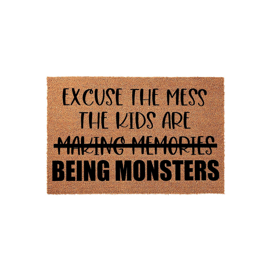 Funny Excuse the Mess Doormat featuring natural coir fibers and bold black text that reads Excuse the Mess, The Kids Are Making Memories, Being Monsters, creating a humorous welcome for any home entrance with a playful