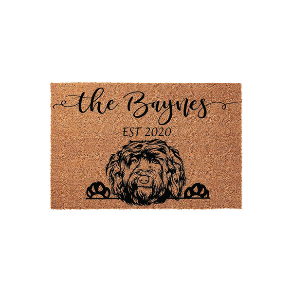 Personalized Doodle Dog Doormat featuring a custom family name and established year printed in black on a natural coir fiber mat, showcasing a detailed illustration of a shaggy dog peeking over the bottom edge with its paws