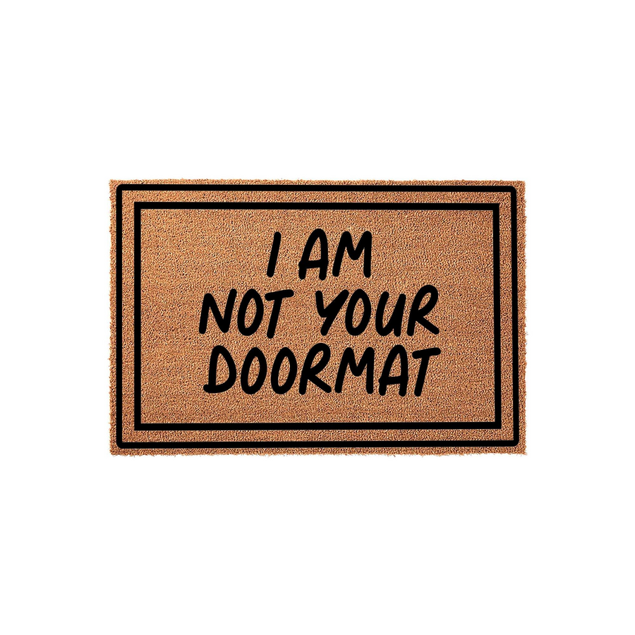 Funny I Am Not Your Doormat coir welcome mat featuring bold black text on a natural tan fiber background, framed by a simple black border that adds a modern touch to this sarcastic and humorous home entryway decor piece.