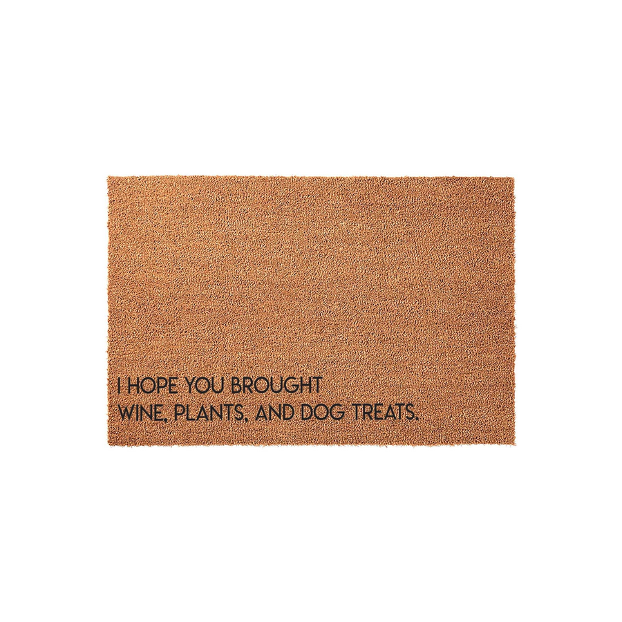 Funny coir doormat featuring the text I Hope You Brought Wine, Plants, and Dog Treats in a clean black font, set against a plain white background to highlight the natural brown texture of the durable outdoor welcome mat material.