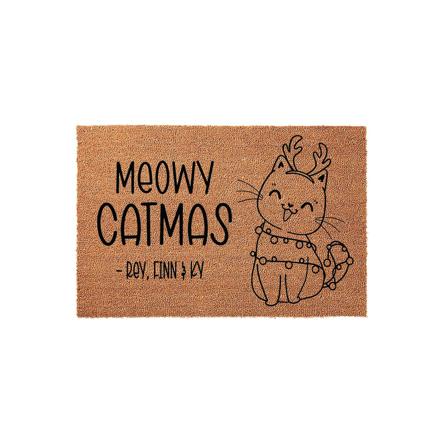 Meowy Catmas Christmas doormat featuring a cute illustrated cat wearing reindeer antlers and holiday lights, set against a natural coir background with space for custom family names to be printed in a playful black font style.