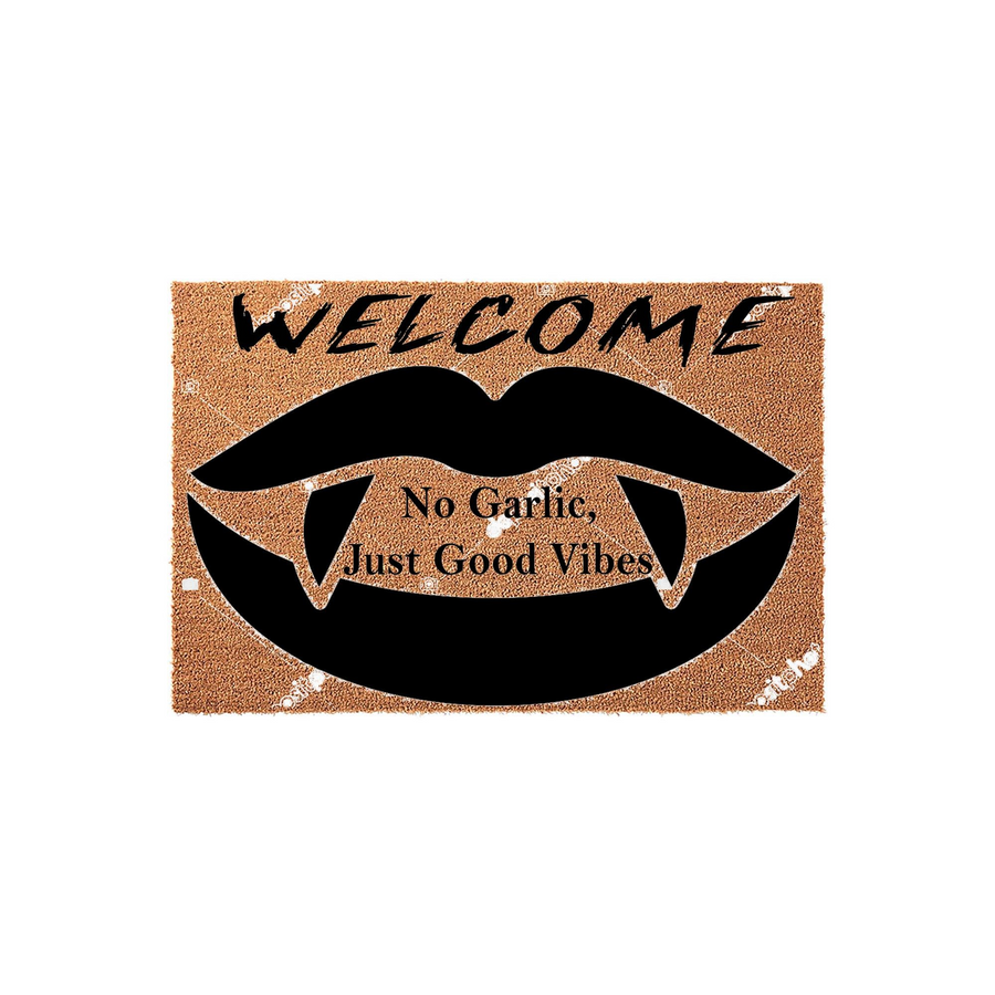 Funny Vampire Welcome Doormat featuring a black graphic of lips with sharp fangs and the text No Garlic, Just Good Vibes printed on a natural tan coir fiber mat, perfect for a spooky Halloween entryway or a gothic home decor