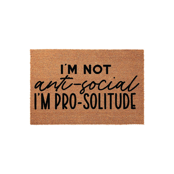 Funny I'm Not Anti-Social I'm Pro-Solitude doormat featuring bold black typography printed on a natural tan coir fiber mat, creating a humorous and welcoming entrance decor piece for any home front porch or entryway floor.