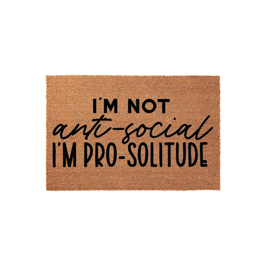 Funny I'm Not Anti-Social I'm Pro-Solitude doormat featuring bold black typography printed on a natural tan coir fiber mat, creating a humorous and welcoming entrance decor piece for any home front porch or entryway floor.