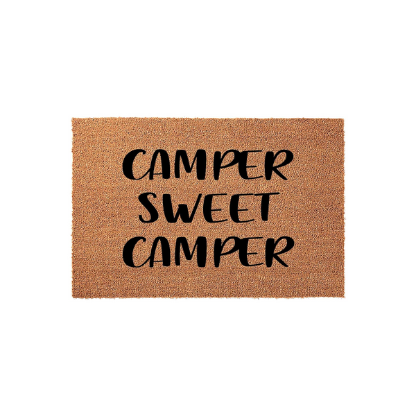 Camper Sweet Camper coir doormat featuring a natural brown fiber texture and bold black lettering, designed as a fun outdoor welcome mat for camping enthusiasts and travel lovers to place outside their RV or motorhome entrance.