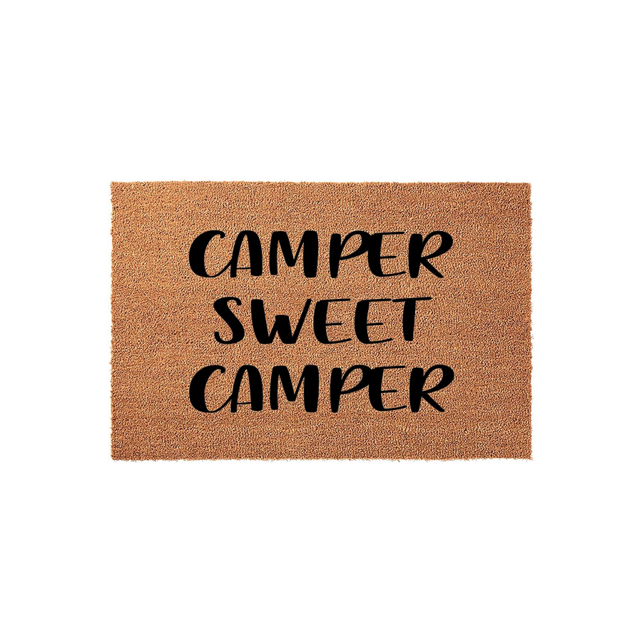 Camper Sweet Camper coir doormat featuring a natural brown fiber texture and bold black lettering, designed as a fun outdoor welcome mat for camping enthusiasts and travel lovers to place outside their RV or motorhome entrance.