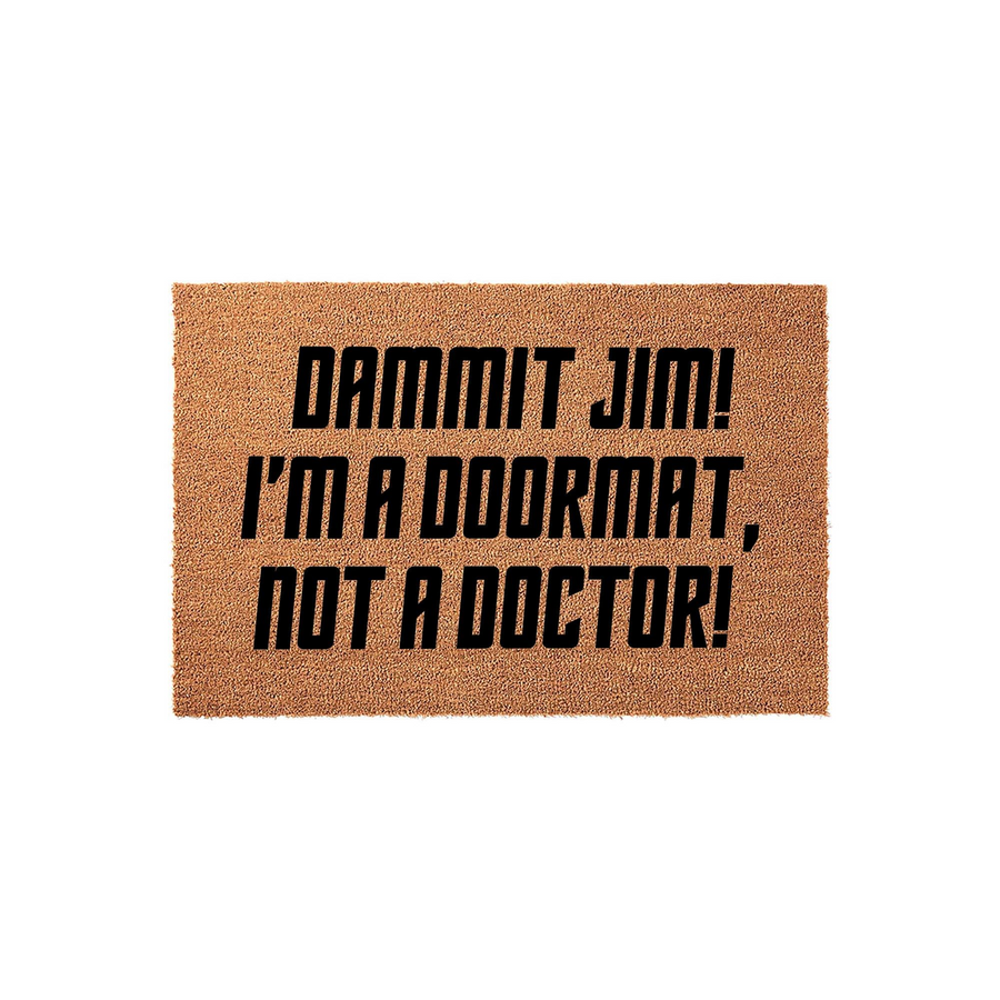 Funny Sci-Fi Themed Coir Doormat featuring the bold black text Dammit Jim! I'm a Doormat, Not a Doctor! printed on a natural brown fiber surface, making it a humorous welcome mat for any fan of classic space exploration