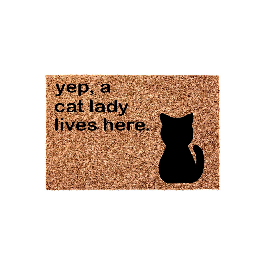 Cat Lady Coir Doormat featuring a natural brown fiber texture with the printed text yep, a cat lady lives here and a bold black silhouette of a sitting cat, making it a fun and welcoming entrance rug for any feline lover's home.
