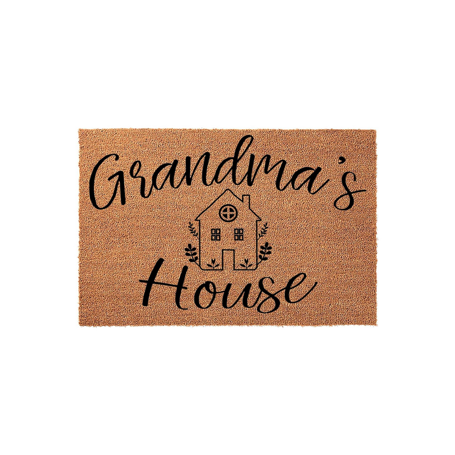 Grandma's House coir doormat featuring a natural tan fiber texture with black printed text and a charming line-art illustration of a small cottage home, creating a welcoming entryway accent for a grandparent's front porch decor.