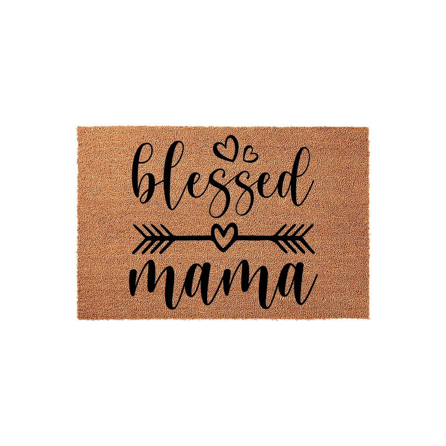Blessed Mama coir doormat featuring a natural brown fiber texture with black script text, decorative hearts, and an arrow design, providing a welcoming and stylish accent for a front porch or entryway floor decor.
