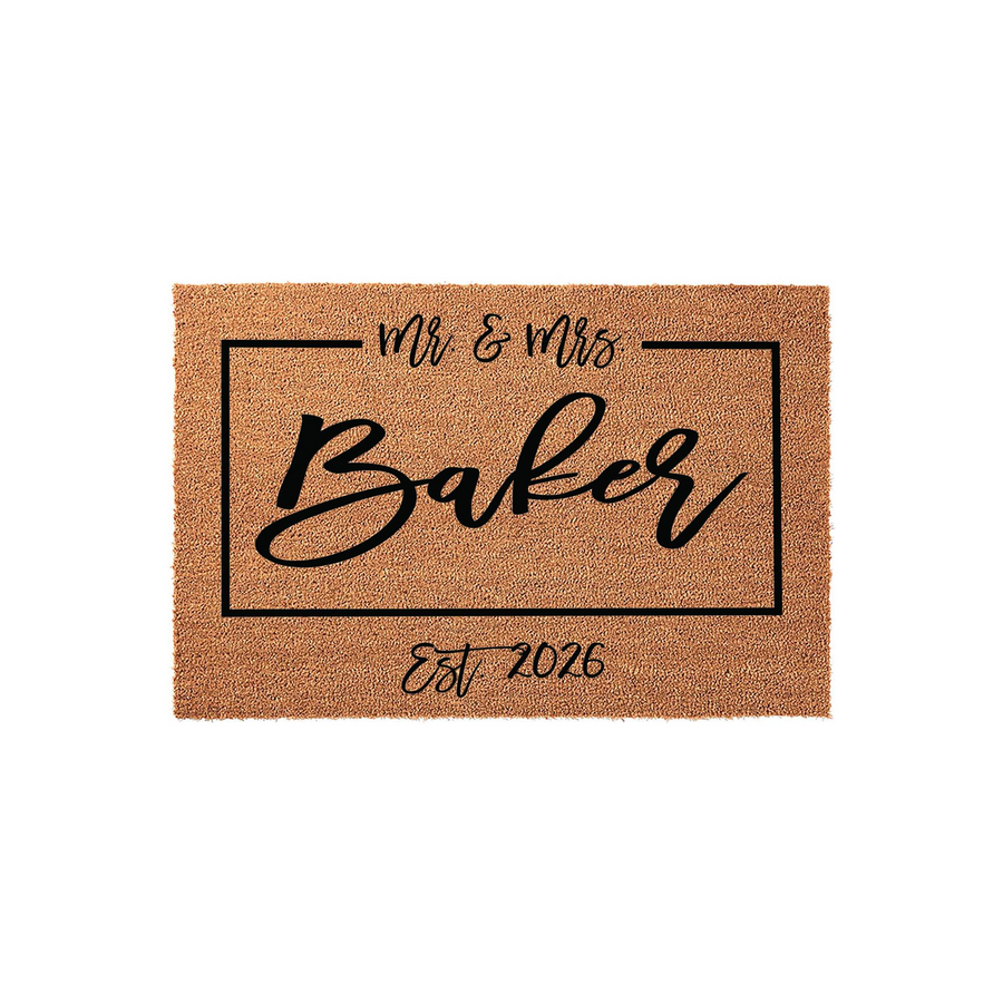 Personalized Mr. and Mrs. coir doormat featuring a black rectangular border, elegant script lettering for the family name, and the established year printed on a natural brown fiber background for a classic wedding or housewarming