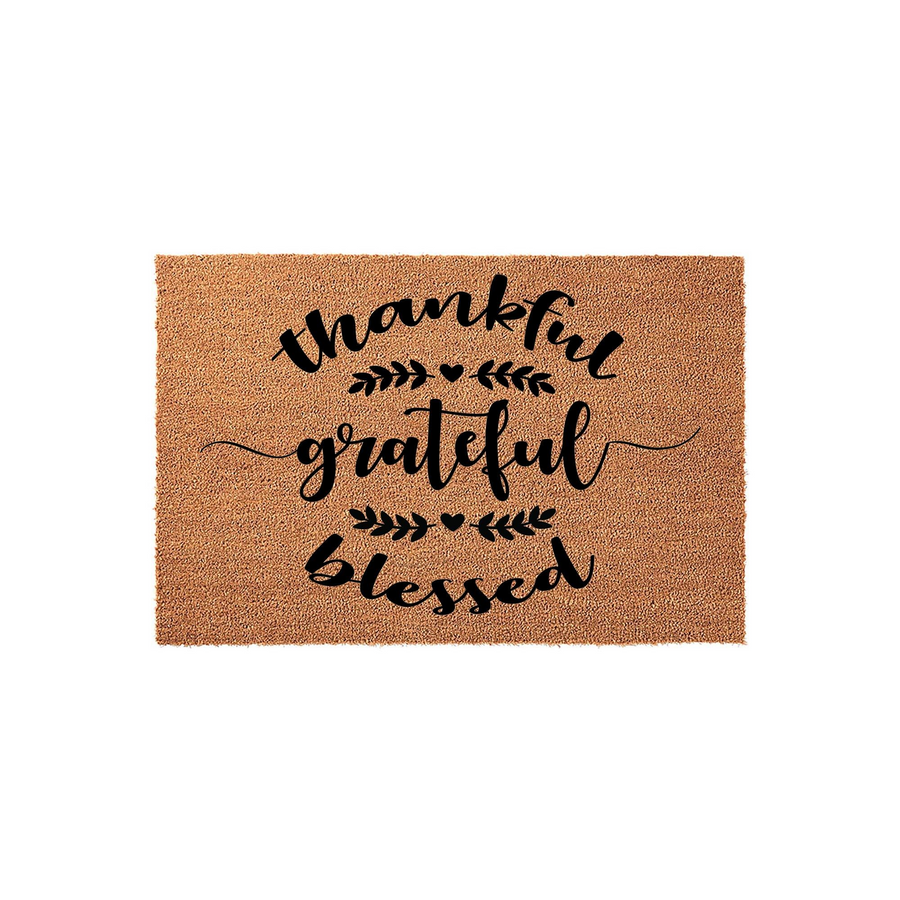 Thankful Grateful Blessed Coir Doormat featuring a natural brown fiber texture with black script lettering and decorative leaf accents, creating a welcoming farmhouse style entrance for your front porch or home entryway.