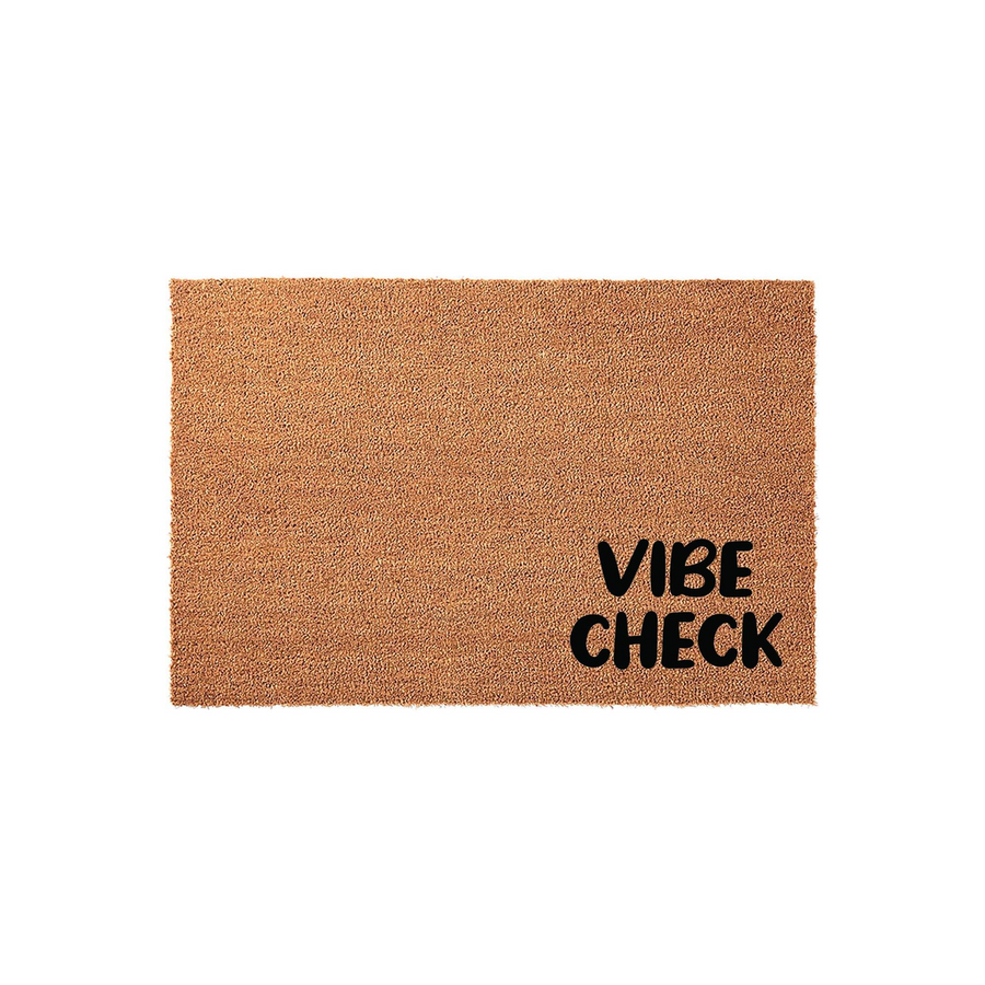Vibe Check Coir Doormat featuring a natural brown coconut fiber texture with the words Vibe Check printed in bold black lettering in the bottom right corner, displayed against a clean white studio background for a modern entryway