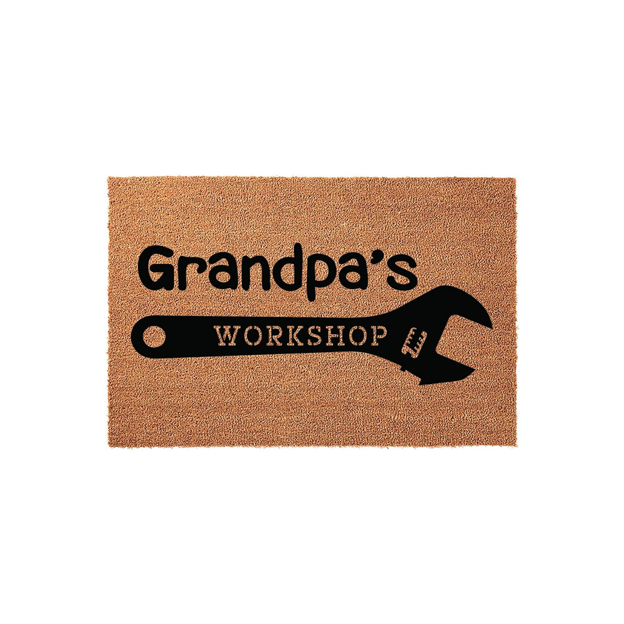 Grandpa's Workshop coir doormat featuring a large black wrench graphic and bold text on a natural tan fiber background, making a fun and durable entrance rug for a garage, shed, or home workshop space for a handy grandfather.