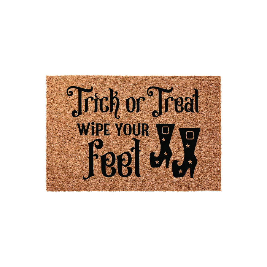 Trick or Treat Halloween doormat made of natural coir fiber, featuring black printed text that reads Trick or Treat Wipe Your Feet alongside a pair of witch boots with star accents for a festive seasonal porch decor entrance.