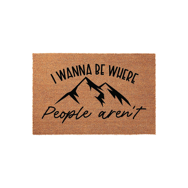 Mountain Theme Coir Doormat featuring a natural brown fiber texture and black printed text that reads I Wanna Be Where People Aren't, centered around a bold mountain range graphic for a rustic outdoor entrance or cabin home decor.