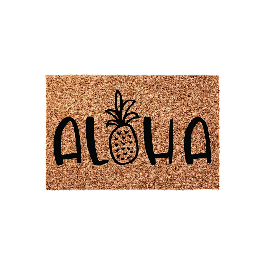 Aloha pineapple coir doormat featuring a natural brown fiber texture with the word Aloha printed in bold black lettering, where the letter O is replaced by a stylized black pineapple illustration on a clean white studio