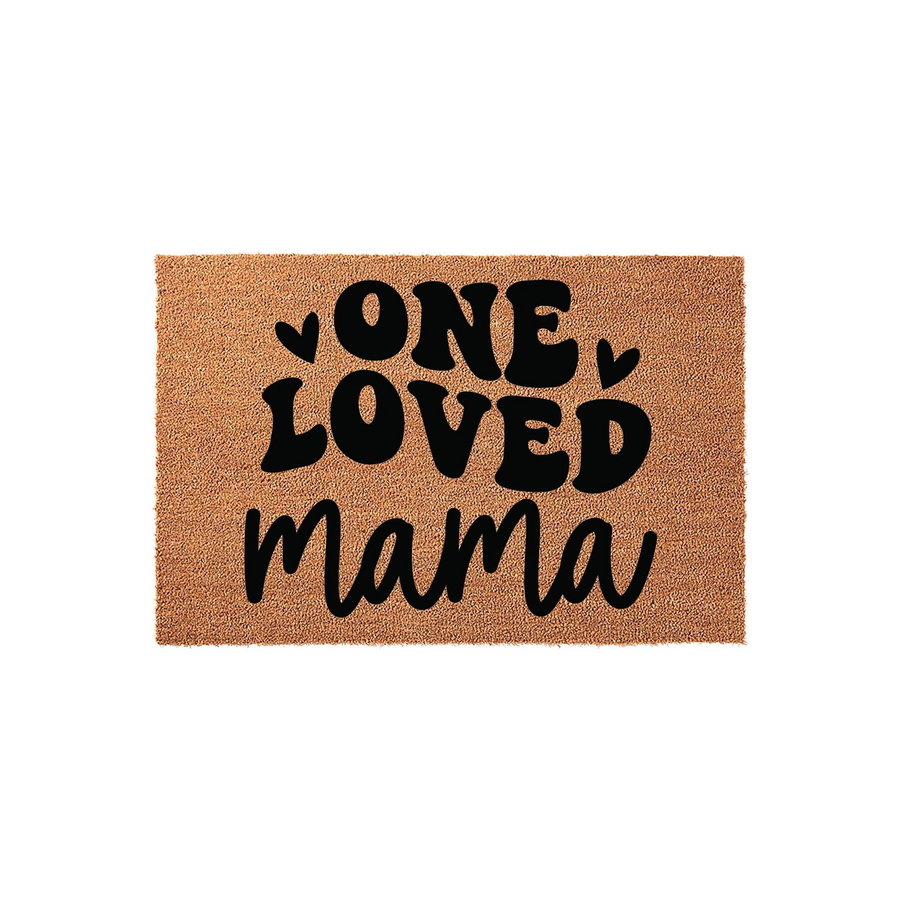 One Loved Mama coir doormat featuring bold black typography and small heart accents on a natural tan fiber background, creating a charming entryway decor piece that celebrates motherhood with a modern and stylish aesthetic.