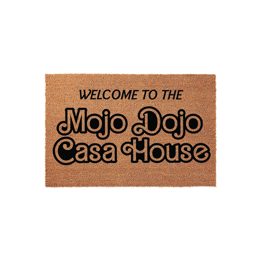 Mojo Dojo Casa House welcome doormat featuring bold, retro-style black typography printed on a natural tan coir fiber mat, creating a fun and trendy entryway accent for any home that loves pop culture references and unique decor.