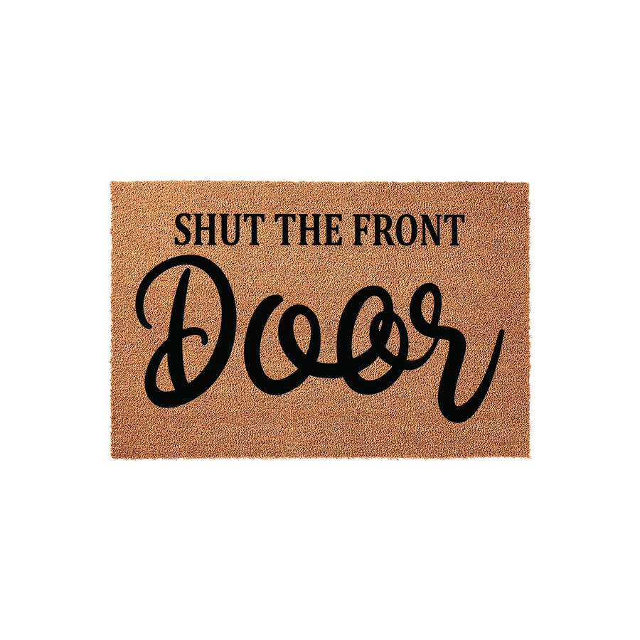 Shut the Front Door coir doormat featuring a natural tan fiber texture and bold black typography that adds a humorous and welcoming touch to your home entryway, displayed against a clean white background for a clear view of the