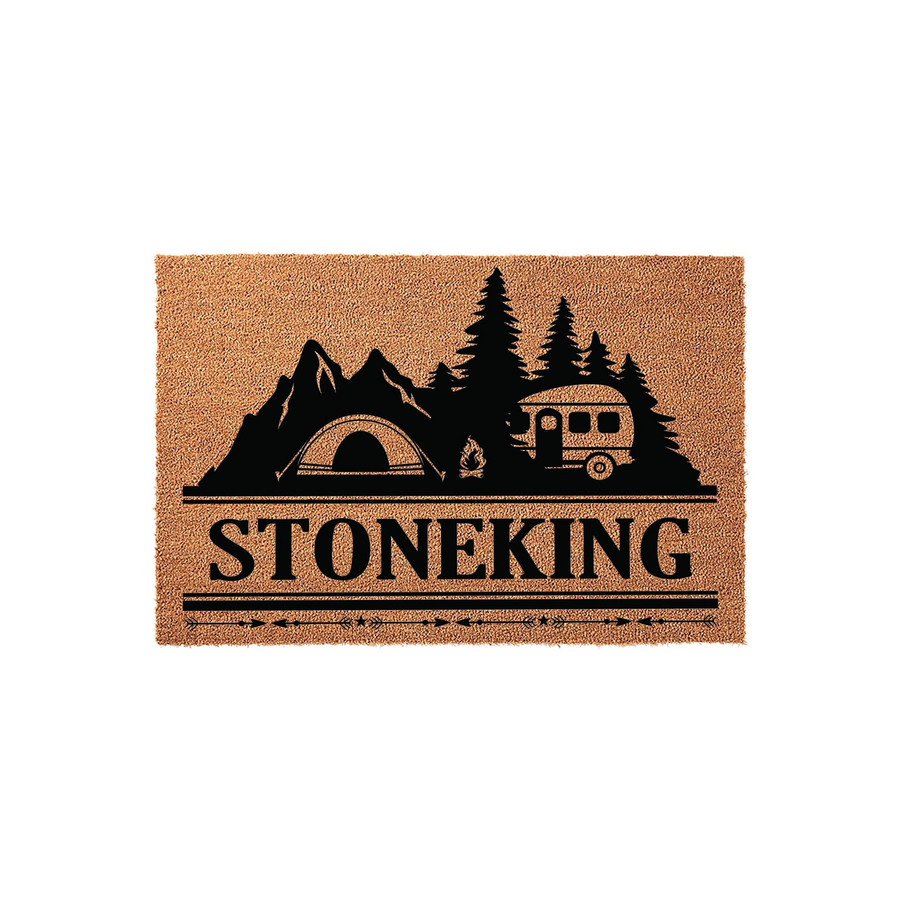 Personalized Camping Themed Coir Doormat featuring a black silhouette of a tent, camper, and pine trees against a natural brown fiber background, with a custom family name printed in bold lettering above a decorative arrow border