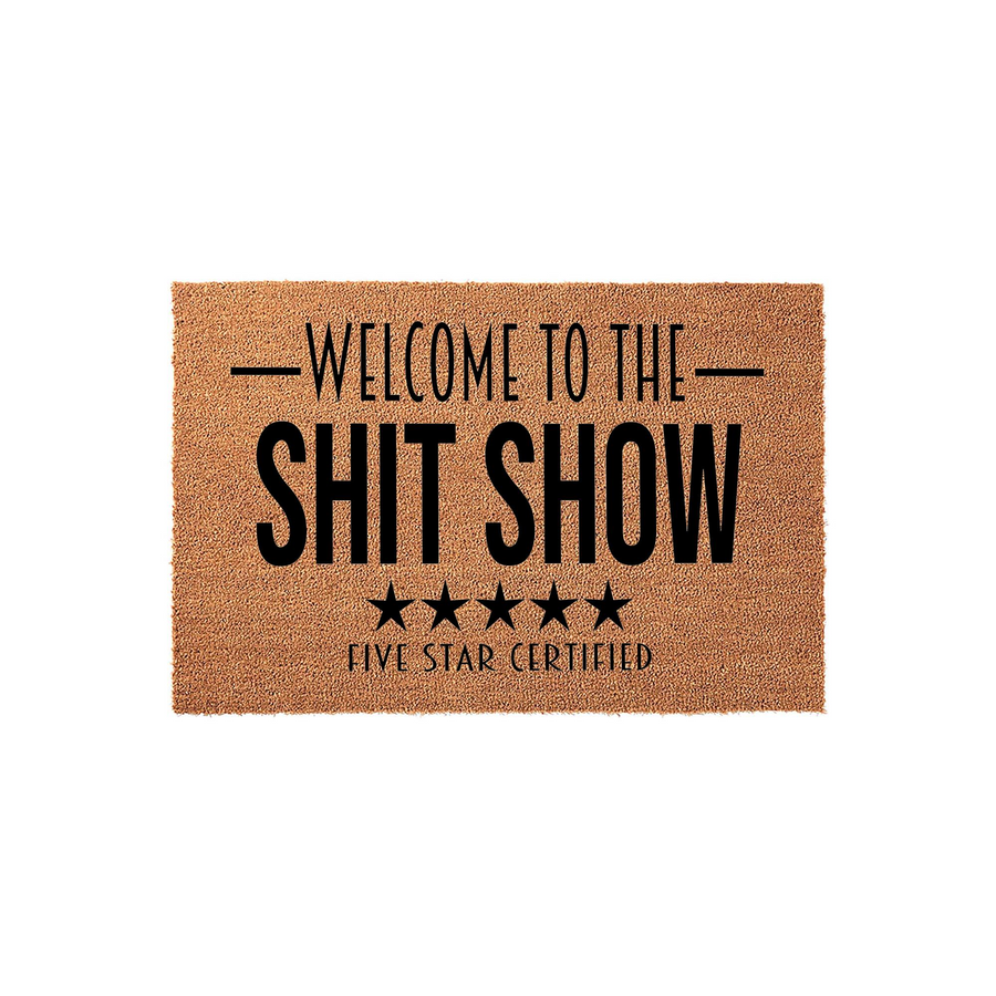 Funny Welcome To The Shit Show doormat featuring bold black text and five stars on a natural coir fiber background, creating a humorous and sarcastic entryway decor piece for your home that is sure to make guests laugh at the