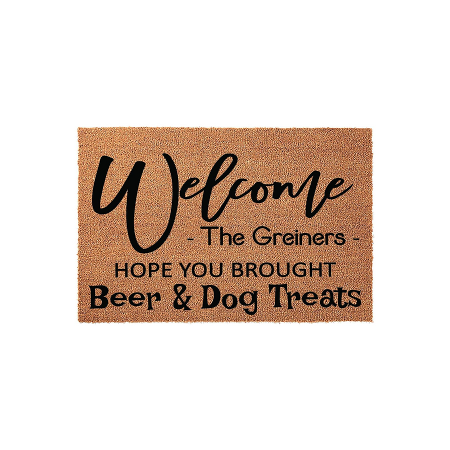 Personalized funny welcome doormat made of natural coir fiber, featuring the text Welcome, a family name placeholder, and the humorous phrase Hope You Brought Beer and Dog Treats printed in bold black lettering on a plain white
