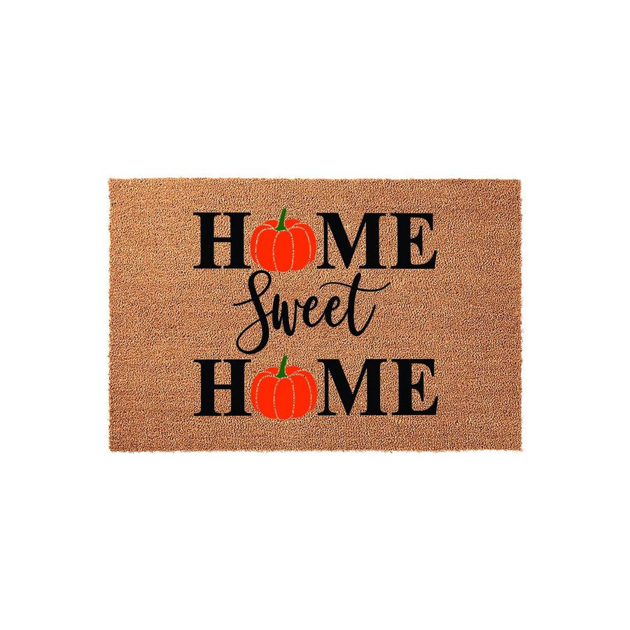 Home Sweet Home fall pumpkin coir doormat featuring a natural tan fiber texture with black lettering and bright orange pumpkin illustrations replacing the letter O in each word, creating a festive autumn entryway decor piece for
