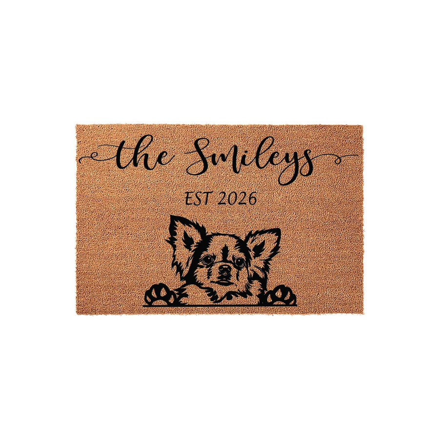 Personalized Chihuahua doormat featuring a cute dog illustration peeking over the edge, printed on a natural coir fiber mat with custom family name text and established year for a welcoming front porch decor addition.