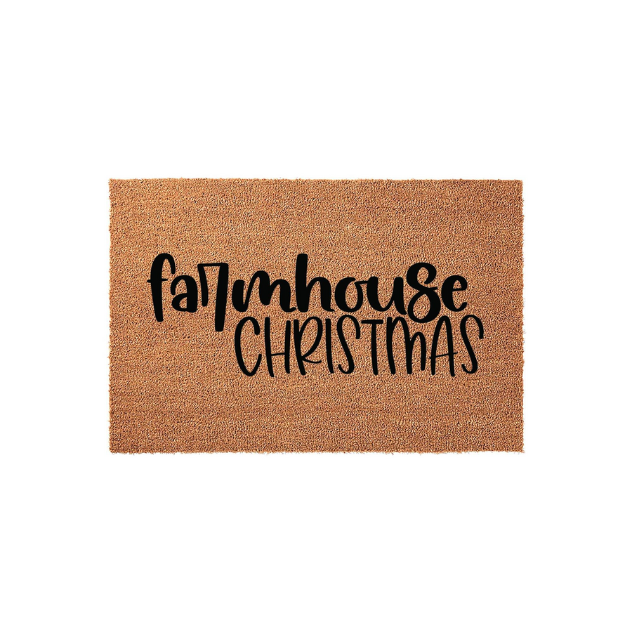 Farmhouse Christmas doormat made of natural coir fiber with a rectangular shape, featuring bold black script lettering that reads Farmhouse Christmas centered on the textured brown surface for a festive holiday entryway decor.