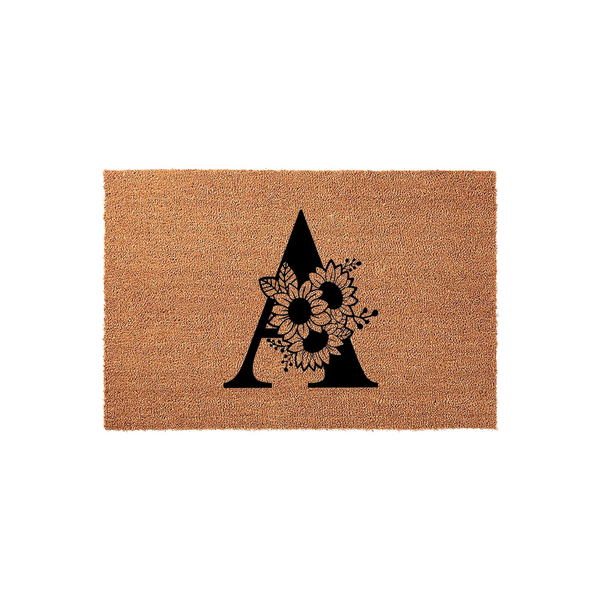 Floral Monogram Coir Doormat featuring a large black letter A decorated with a cluster of detailed sunflowers and leaves, set against a natural brown textured coconut fiber background for a rustic and welcoming front porch