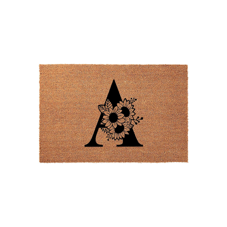 Floral Monogram Coir Doormat featuring a large black letter A decorated with a cluster of detailed sunflowers and leaves, set against a natural brown textured coconut fiber background for a rustic and welcoming front porch