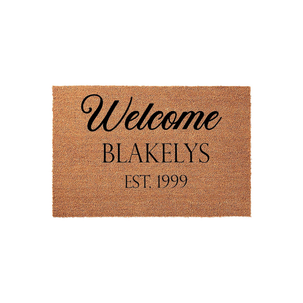 Personalized family name coir doormat featuring the word Welcome in elegant script, followed by a custom last name and established year, all printed in black ink on a natural brown textured coconut fiber welcome mat surface.