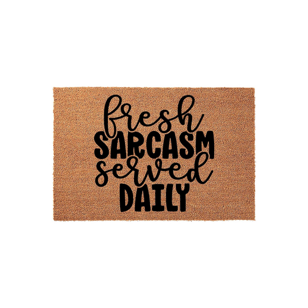 Fresh Sarcasm Served Daily coir doormat featuring bold black typography printed on a natural brown coconut fiber mat, creating a humorous and welcoming entrance piece for your front porch or home entryway decor.
