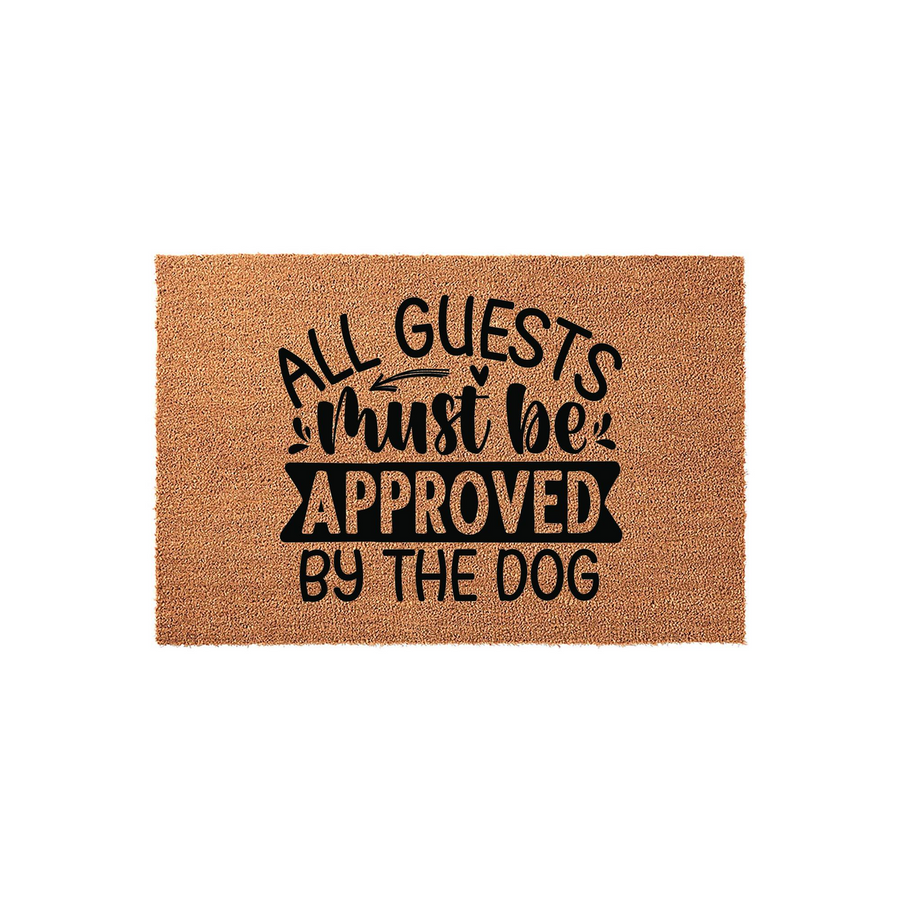 Funny Dog Lover Coir Doormat featuring the text All Guests Must Be Approved By The Dog in bold black lettering, set against a natural tan fiber background for a charming and welcoming front porch decor addition for any pet owner.