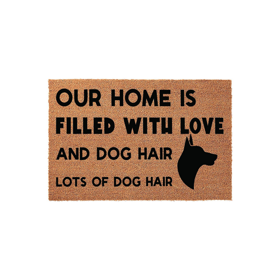 Funny Dog Hair Welcome Doormat featuring a Doberman silhouette and the text Our Home Is Filled With Love And Dog Hair Lots Of Dog Hair, printed on a natural tan coir fiber mat against a clean white background for a pet lover home