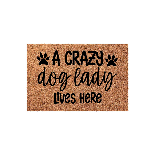 Crazy Dog Lady Coir Doormat featuring a natural brown fiber texture with black text that reads A Crazy dog lady Lives Here, accented by two paw prints on a clean white background for a fun and welcoming front porch entryway decor.