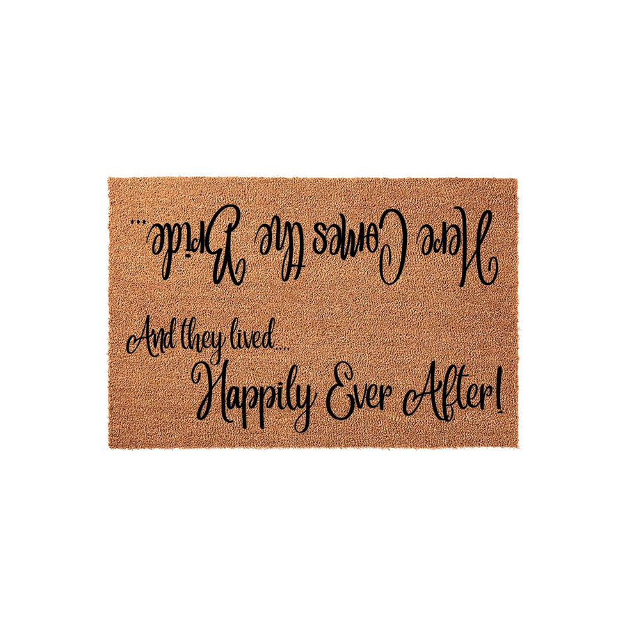 Wedding Welcome Doormat featuring natural coir fibers and black script text that reads Here Comes the Bride and And they lived Happily Ever After, designed as a charming entryway floor mat for a newlywed couple's home on a white