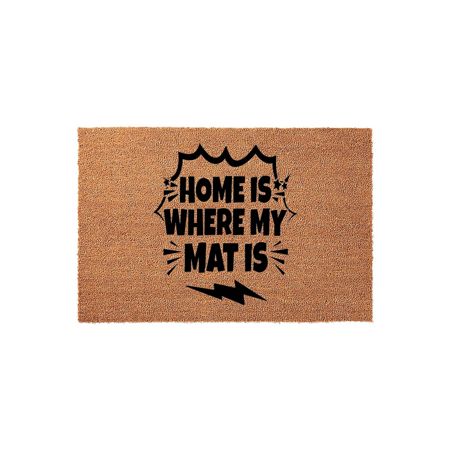 Home Is Where My Mat Is coir doormat featuring a bold comic book style graphic with black text, a speech bubble outline, and a lightning bolt icon printed on a natural brown textured fiber surface against a plain white background.