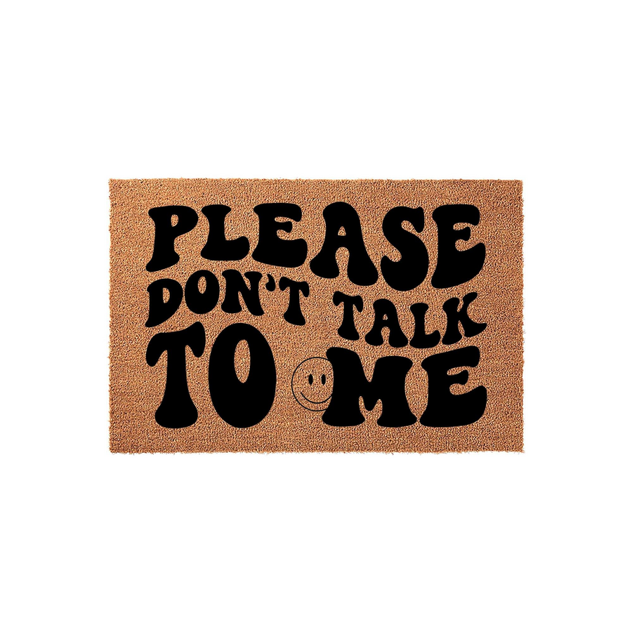 Funny Please Don't Talk To Me coir doormat featuring bold, retro-style black typography and a small smiley face icon on a natural brown fiber background, creating a humorous and welcoming entrance for your front porch or home