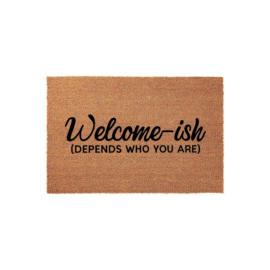 Funny Welcome-ish Doormat made of natural coir fiber with a rustic texture, featuring the text Welcome-ish and Depends Who You Are printed in bold black lettering against a plain white background for a humorous front porch