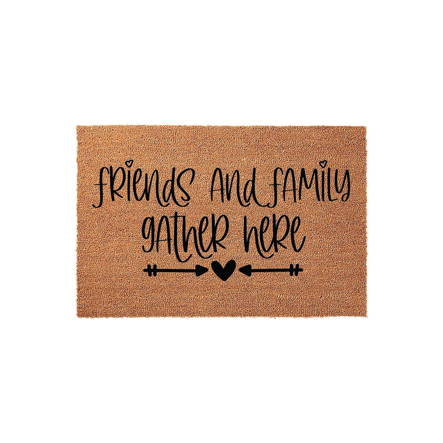 Friends and Family Gather Here coir doormat featuring a natural brown fiber texture with black script lettering and a decorative arrow and heart design, creating a welcoming entryway accent for your home front porch or doorstep
